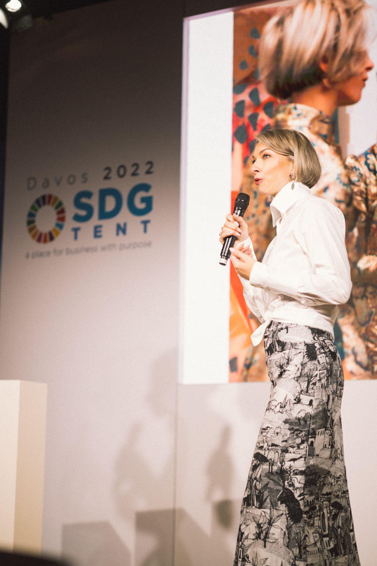 Nicky Myny speaking on stage at the SDG Tent, WEF Davos 2022.